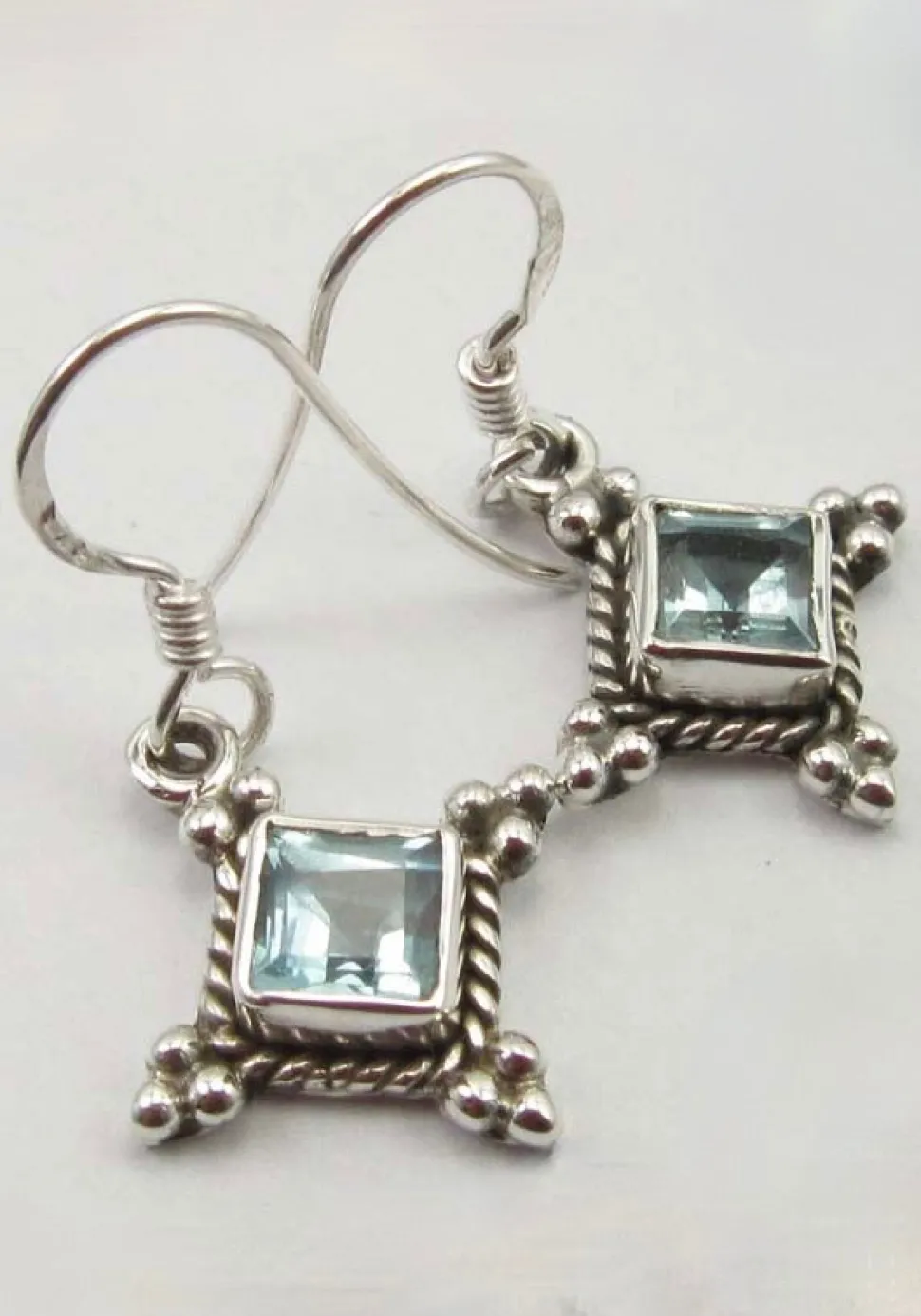 solid_silver_blue_topaz_d_0-1.webp Solid Silver Blue Topaz Diamond shaped Drop Earrings