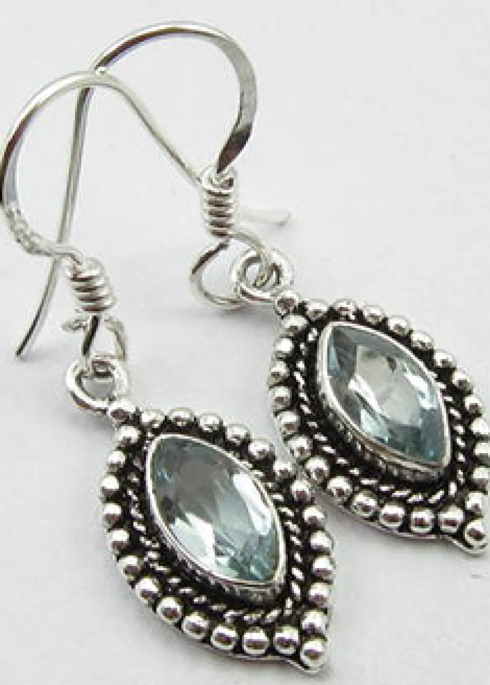 solid_silver_blue_topaz_o_0.webp Solid Silver Blue Topaz Ornate Drop Earrings