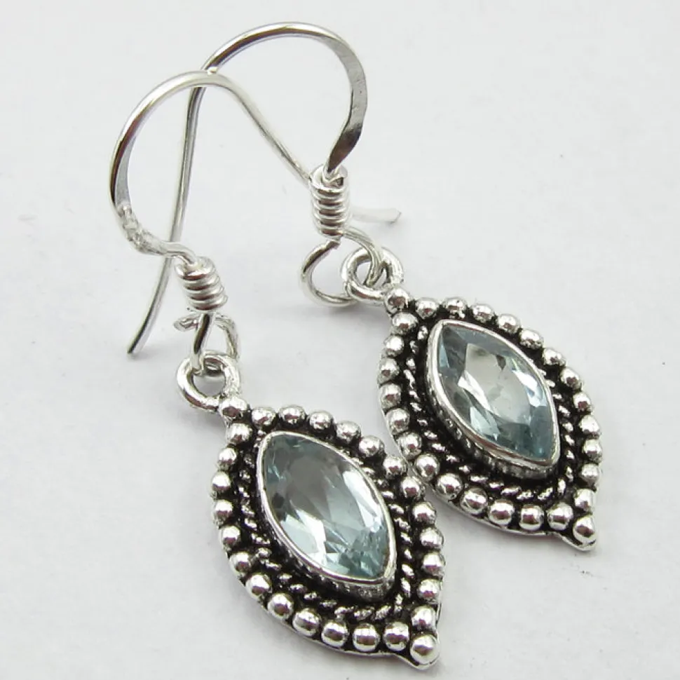 solid_silver_blue_topaz_o_1.webp Solid Silver Blue Topaz Ornate Drop Earrings