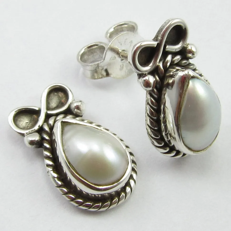 solid_silver_pearl_and_bo_2.webp Solid Silver Pearl and Bow Stud Earrings