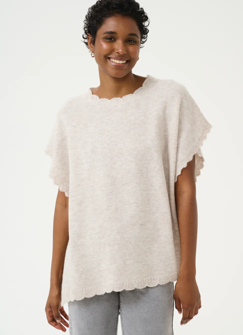 dammi_knit_poncho_in_stri_0.webp Dammi Knit Poncho in String Melange