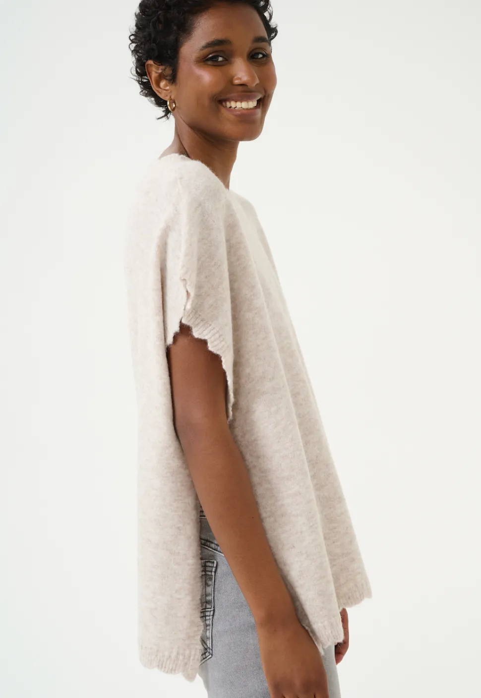 dammi_knit_poncho_in_stri_3.webp Dammi Knit Poncho in String Melange