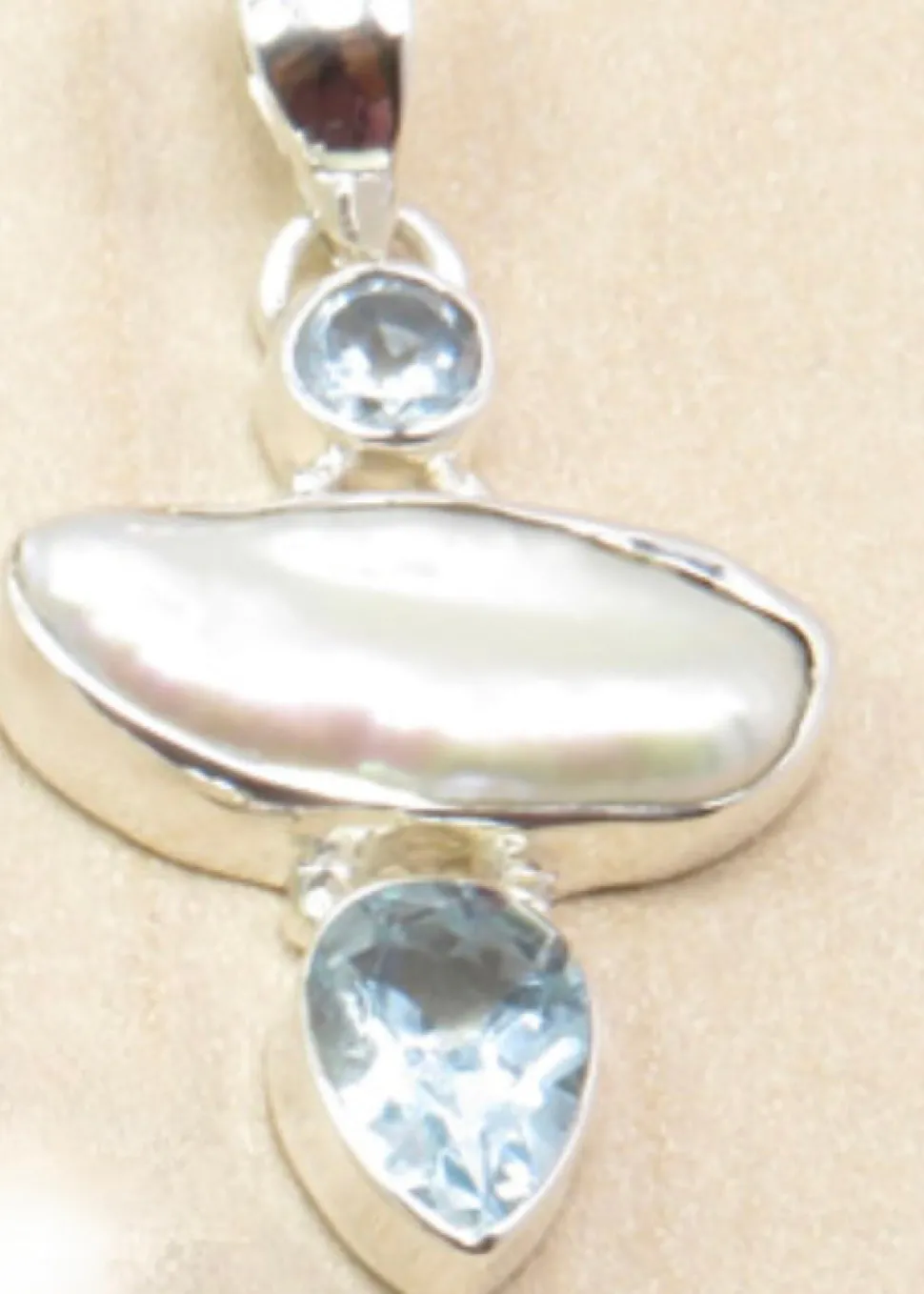 solid_silver_handmade_biw_2.webp Solid Silver Handmade Biwa Pearl Pendants